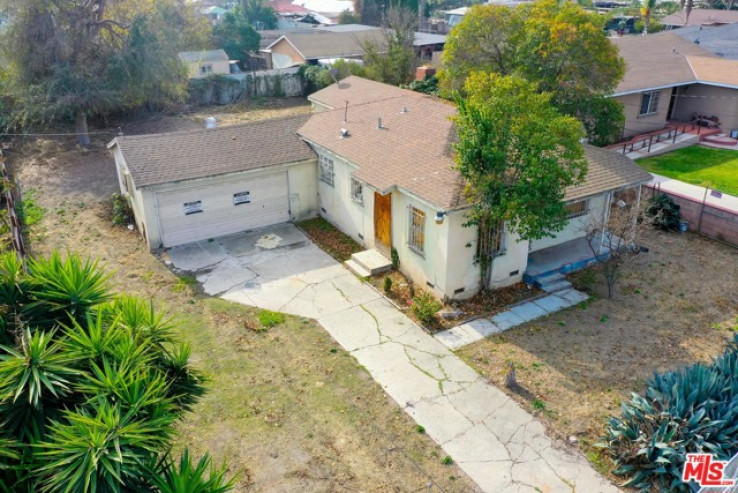 Residential Home in Compton S of Rosecrans, E of Central,W of Ala