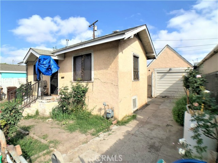 Residential Home in Compton S of Rosecrans, E of Central,W of Ala
