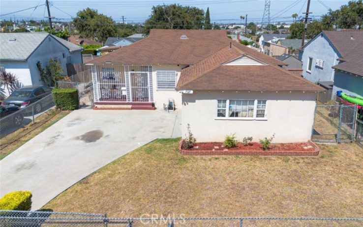Residential Home in Compton S of Rosecrans, E of Central,W of Ala